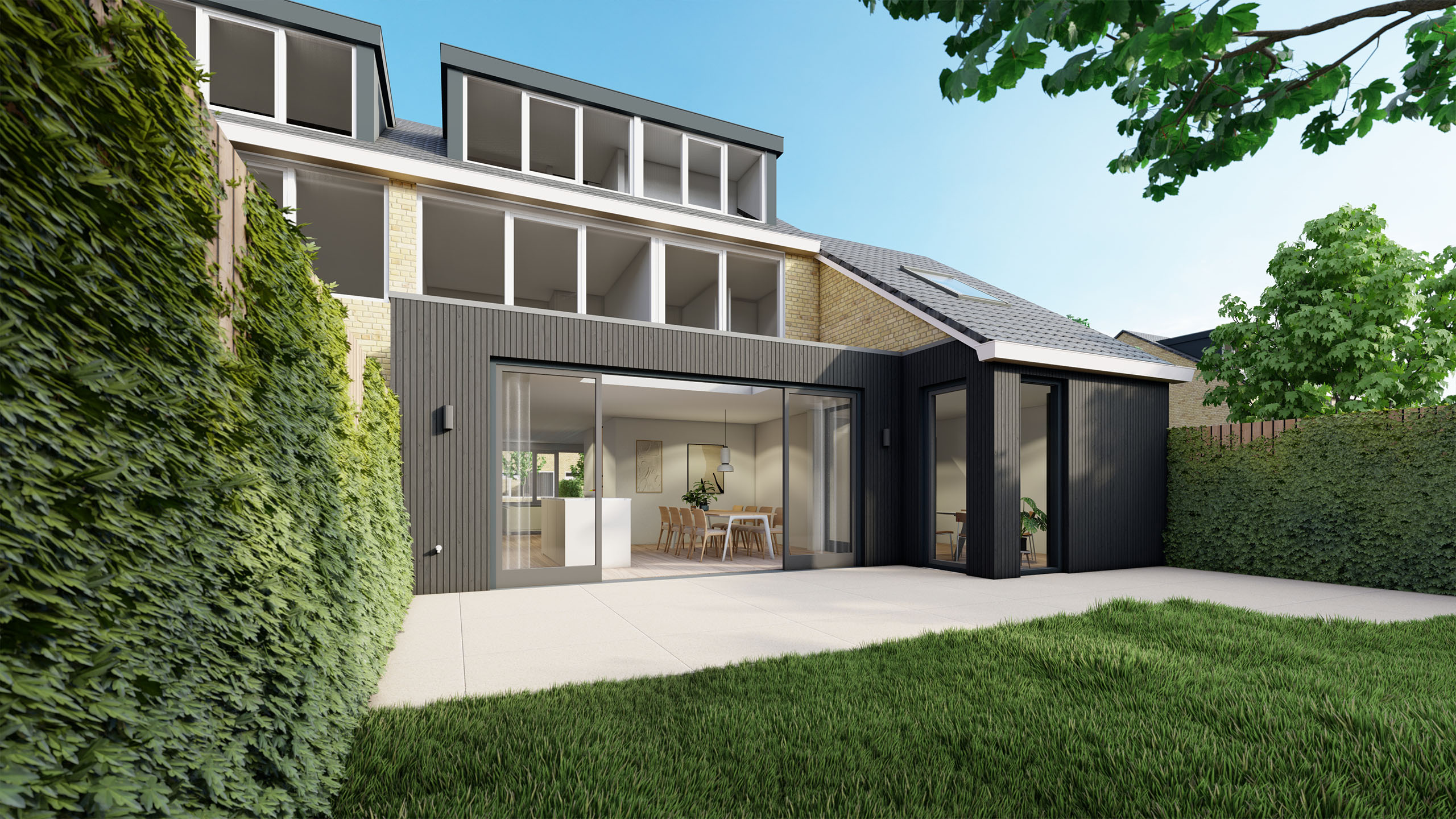 Impressie van een zwarte aanbouw met veel glas. 